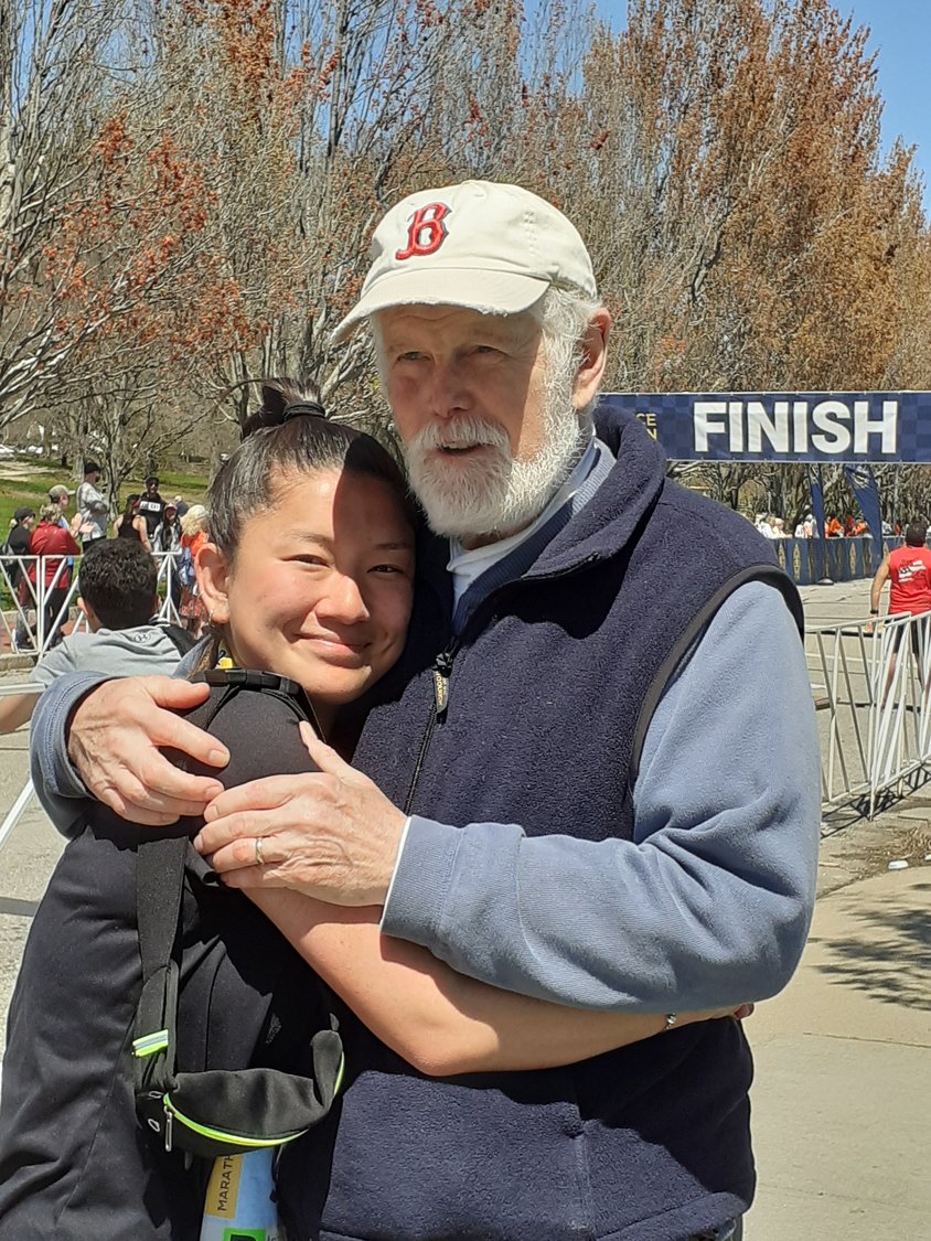 Larry and Arianna embrace after she finished the Providence Marathon on May 1.